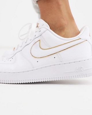 Nike Air - Force 1 '07 - Sneakers bianco e oro | ASOS